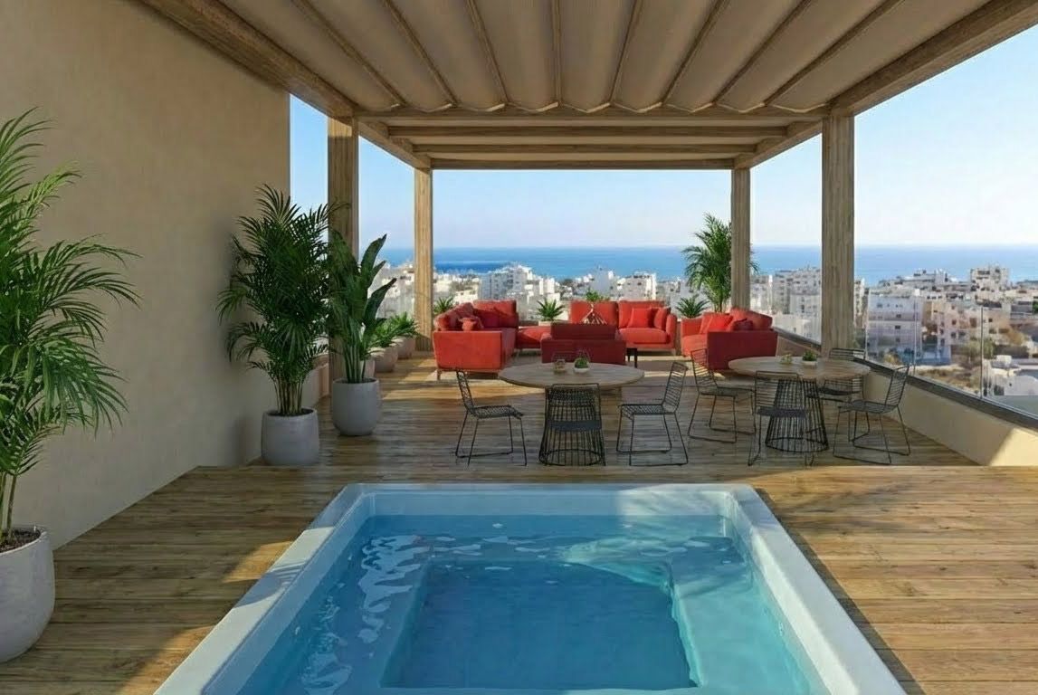 Open living room with kitchen and blue poufs